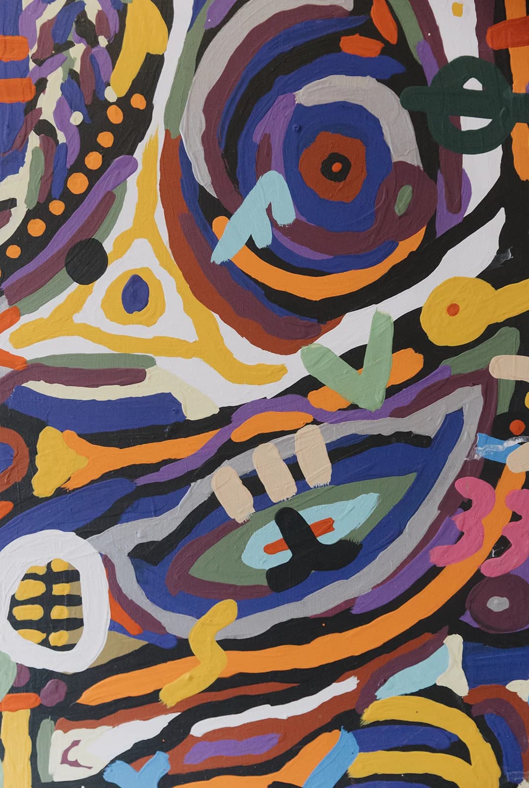 An abstract painting of strokes and eyes in intense colours, from the house